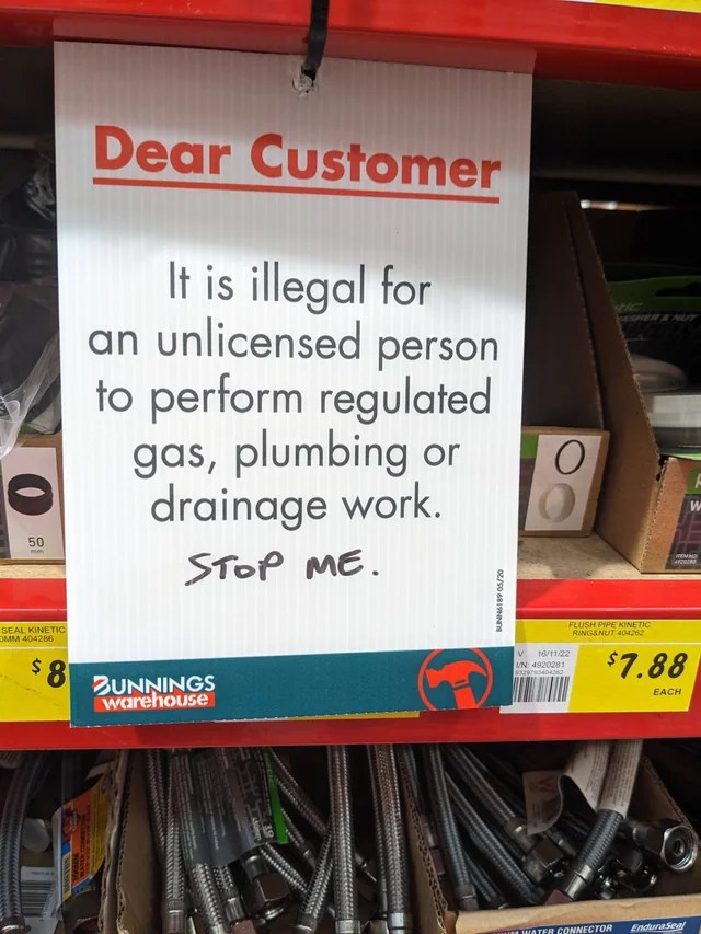 meme showing a sign hung in the store that advises customers against doing their own plumbing or electrical work. Someone has written below it, "Stop me"