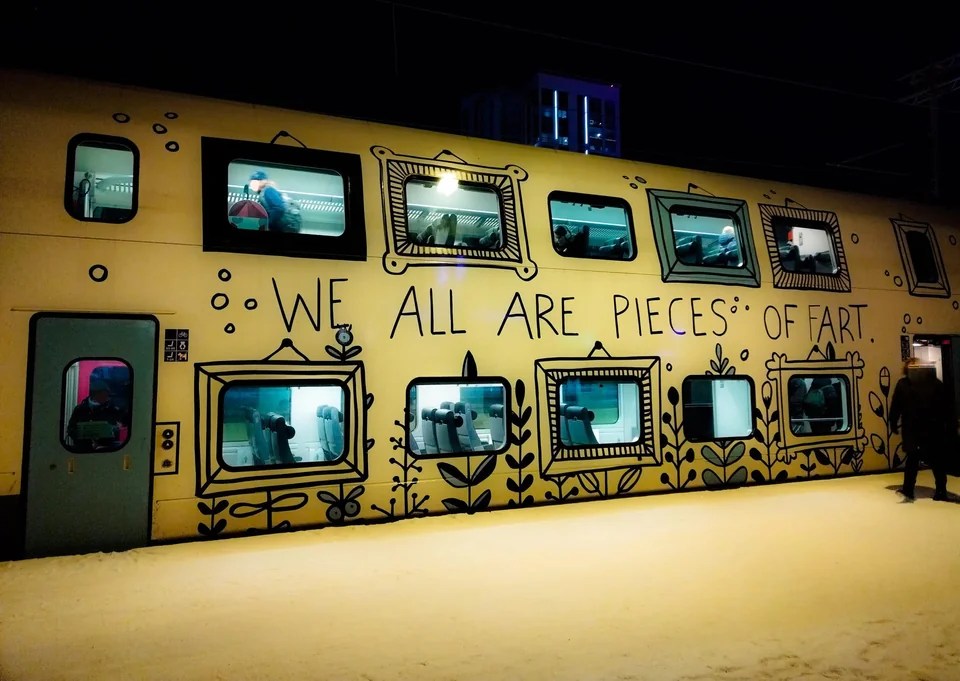 art mural that says "we are all pieces of art," but someone added an F so it says Fart.