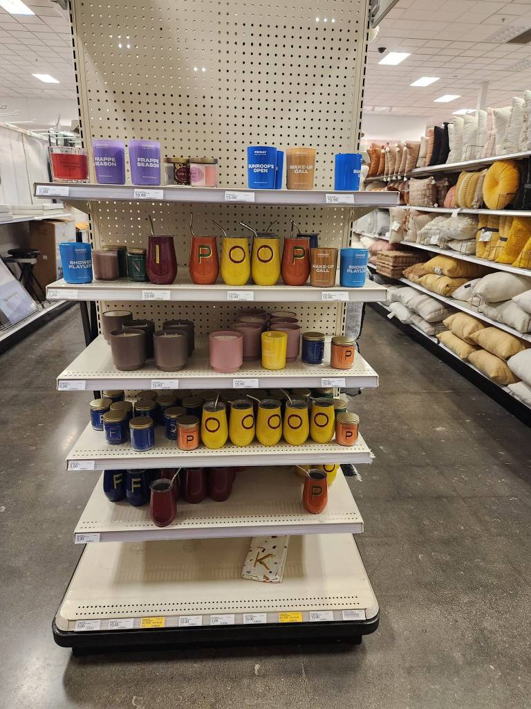 Target end cap with cups, but somene has arranged the cups to say Poop