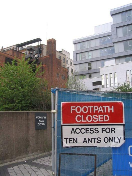 sign that has been altered so it says "footpath closed, access for ten ants only"