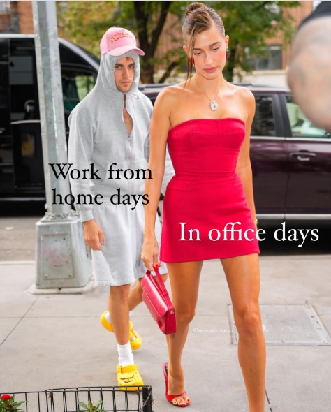 Justin Beiber wearing a weird rain slicker with wife Haley wearing a glamourous dress.