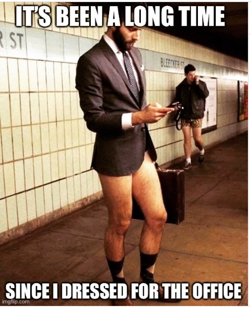 men in subway wearing suits on top and shorts on bottom.